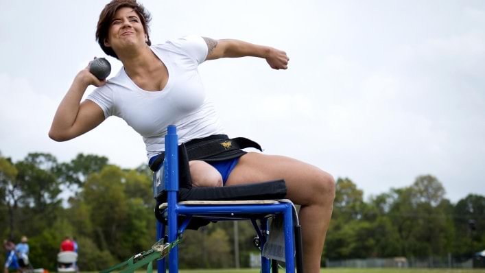 Sebastiana throwing a shotput in training