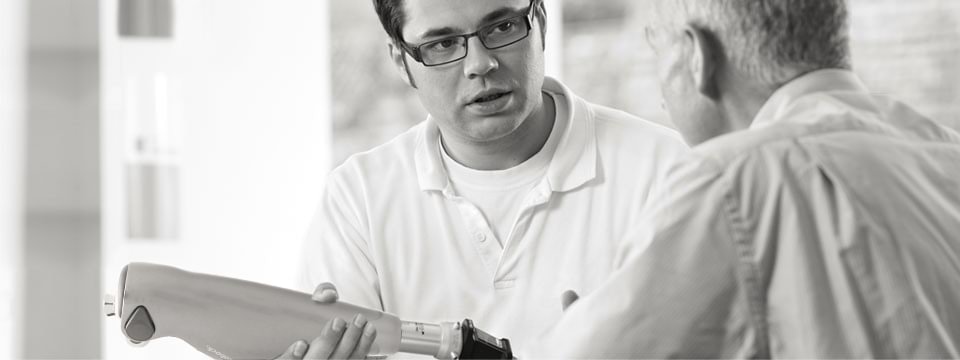 Orthopedic technician explains C-Leg system to a patient.