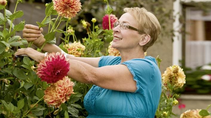 Michelangelo prosthetic hand user with flowers